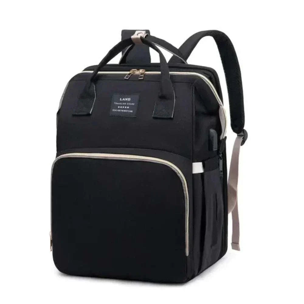 Sac à dos pratique Sac à dos pratique noir en tissu, au design structuré, avec nombreuses poches et détails zippés contrastants.