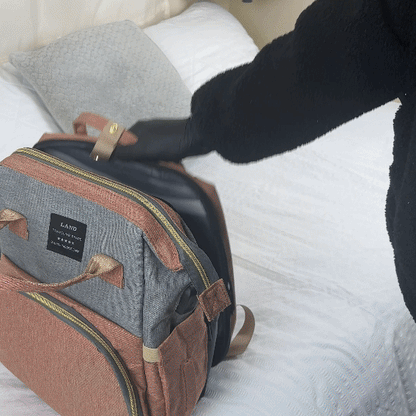 Sac à dos pratique Sac à dos pratique en tissu gris et rose cuivré, avec poches zippées, détails en similicuir et poignées